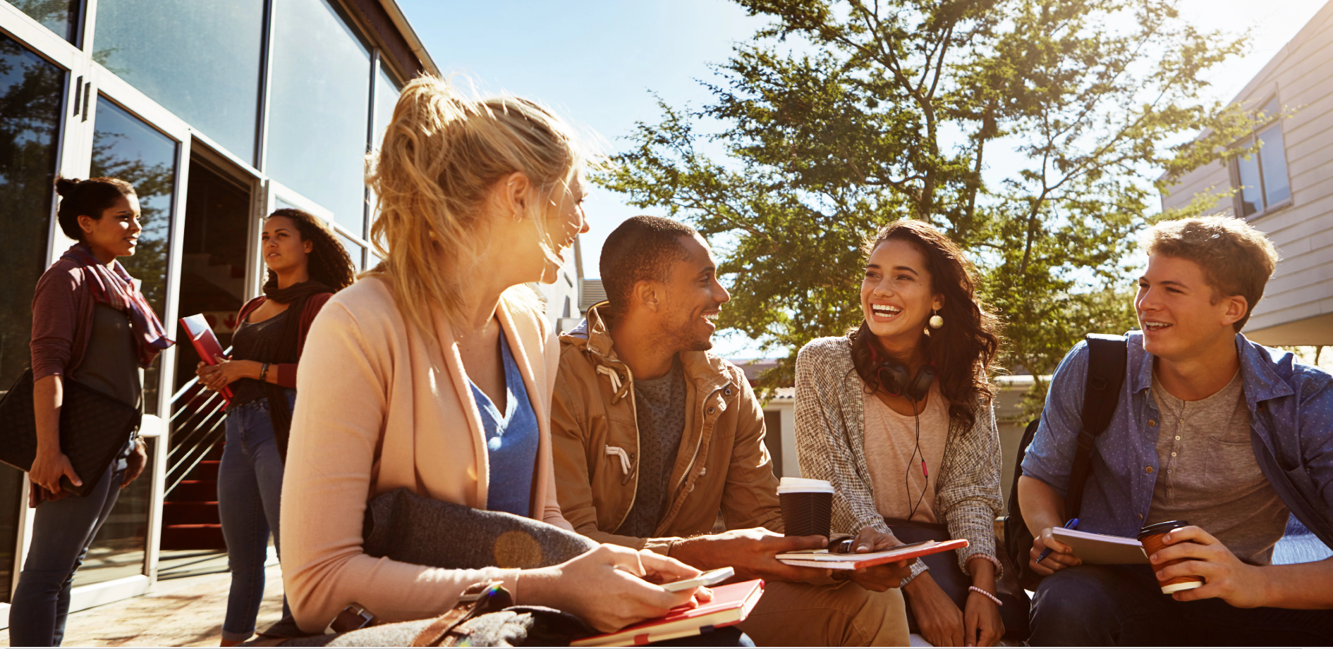 Students laughing and working together on campus